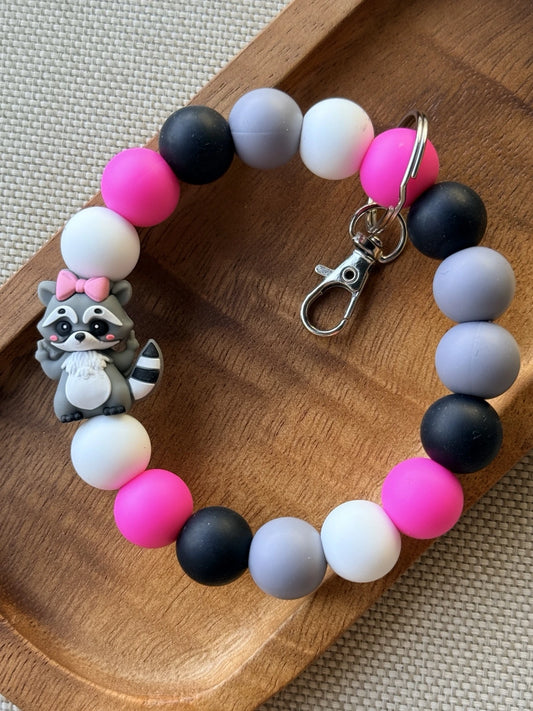 Rascal in Pink raccoon beaded wristlet, available as a finished wristlet or as a DIY silicone bead kit.