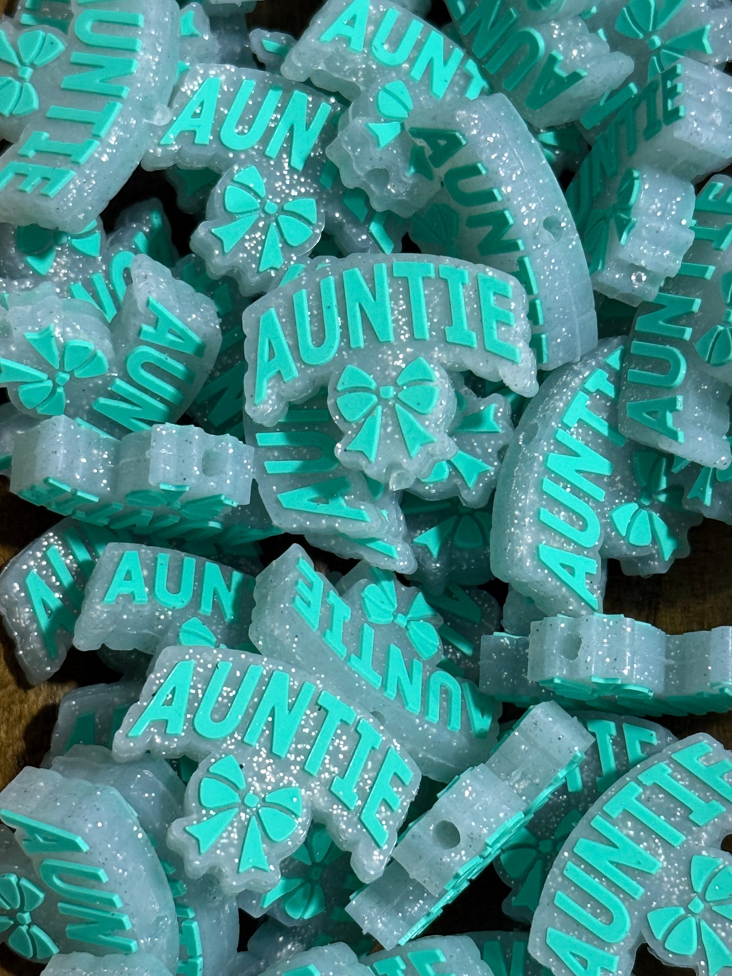 “Auntie” Silicone Focal Bead with Bow – Glitter Teal | Sold Individually