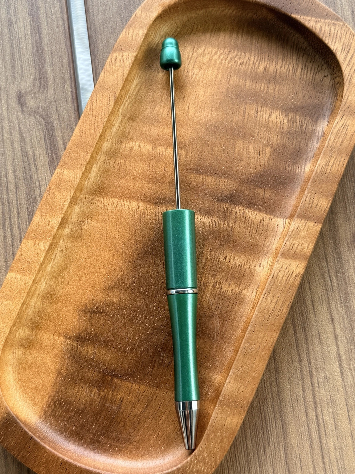Evergreen Shimmer beadable pen featuring a metallic emerald green finish with refillable black ink and beadable pen hardware.