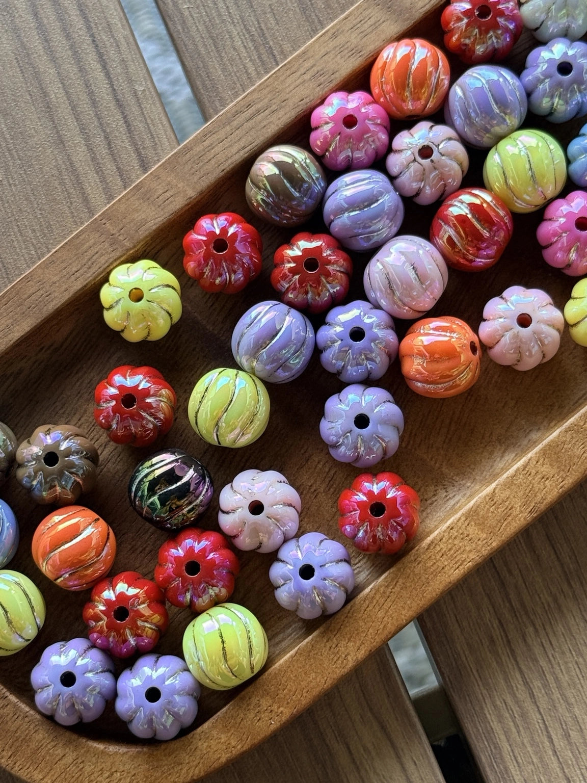 16mm acrylic bead mix featuring pumpkin-shaped and round beads in fall harvest colors including orange, lavender, red, blush pink, green, and marbled autumn tones for seasonal crafting projects.