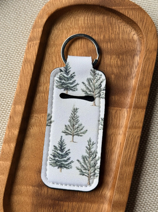 Soft neoprene chapstick holder keychain by Four Seasons of Happiness featuring assorted floral, Christmas, winter, holiday and seasonal printed designs with a durable metal keyring.