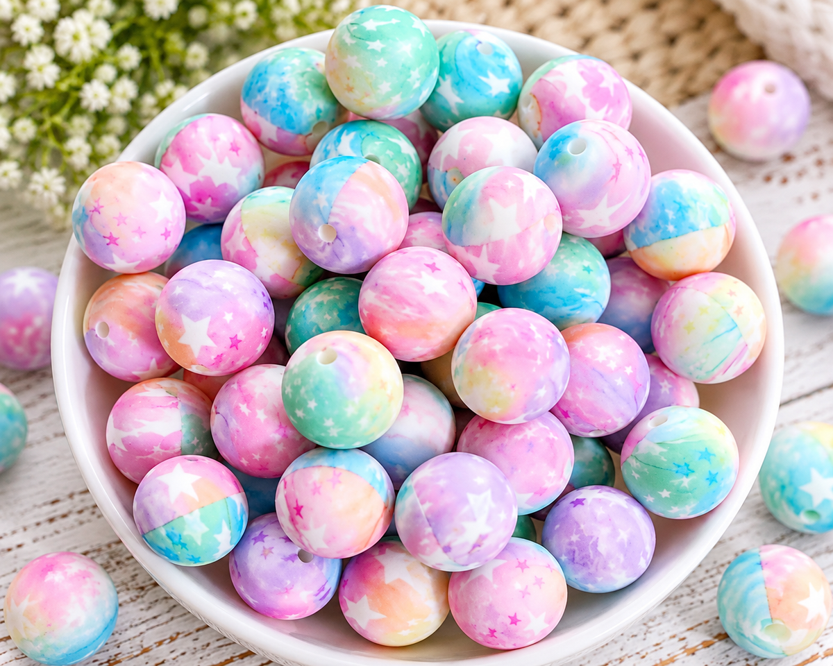 Pastel star print silicone beads in pink, lavender, turquoise and mint for wristlet keychains, bag charms and DIY crafts.