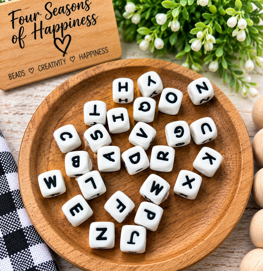 12mm white silicone alphabet letter beads with black A–Z letters for personalized wristlets, keychains, bag charms and DIY bead crafts.