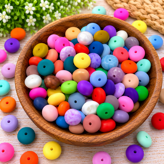 Assorted 14mm silicone abacus spacer beads in bright, pastel, and neutral colors, sold in random mixed-color bags of 25.
