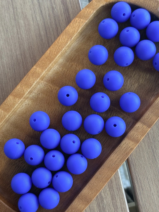     15mm Blueberry Bliss silicone round beads featuring a vibrant royal blue matte finish for DIY keychains, wristlets, beadable pens, badge reels, and handmade craft projects.