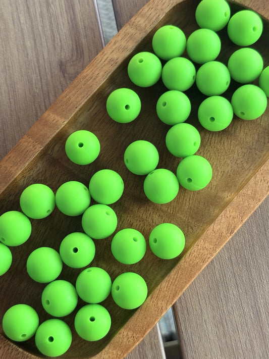    15mm Electric Lime silicone round beads featuring a vibrant neon green matte finish for DIY keychains, wristlets, beadable pens, badge reels, and handmade craft projects.