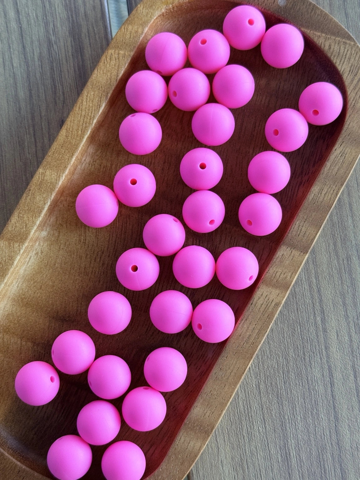     15mm Tickled Pink silicone round beads featuring a vibrant hot pink matte finish for DIY keychains, wristlets, beadable pens, badge reels, and handmade craft projects.