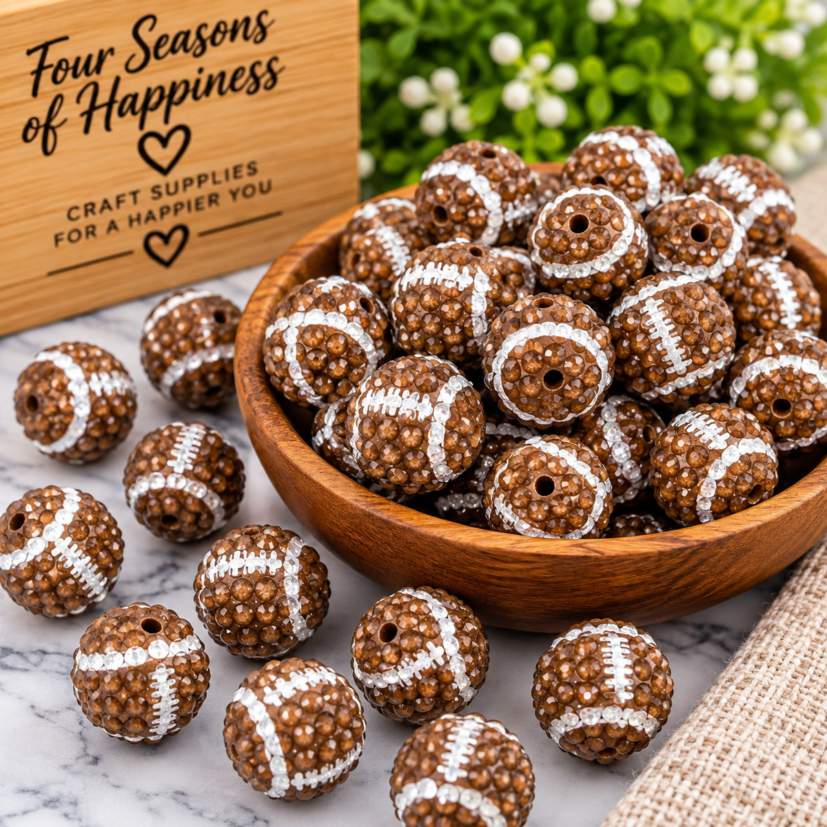 20mm brown acrylic rhinestone football beads with textured surface and white football detailing for wristlets, keychains and DIY crafts.