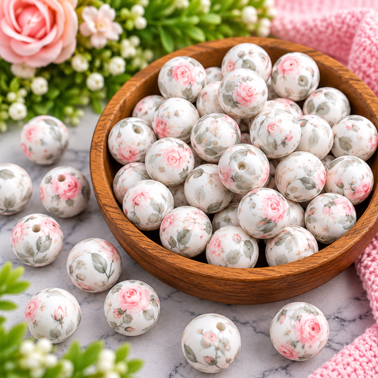Blushing Rose Garden 15mm printed silicone bead with soft pink roses and muted green leaves on a creamy white background, sold individually by Four Seasons of Happiness.