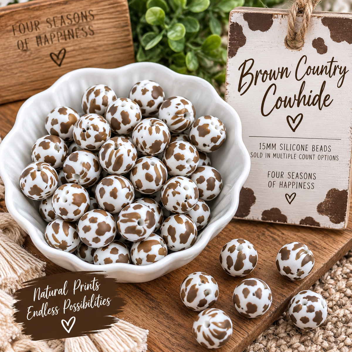 Brown Country Cowhide 15mm printed silicone beads featuring white beads with assorted brown cowhide patterns, styled for DIY wristlets, keychains and craft projects.