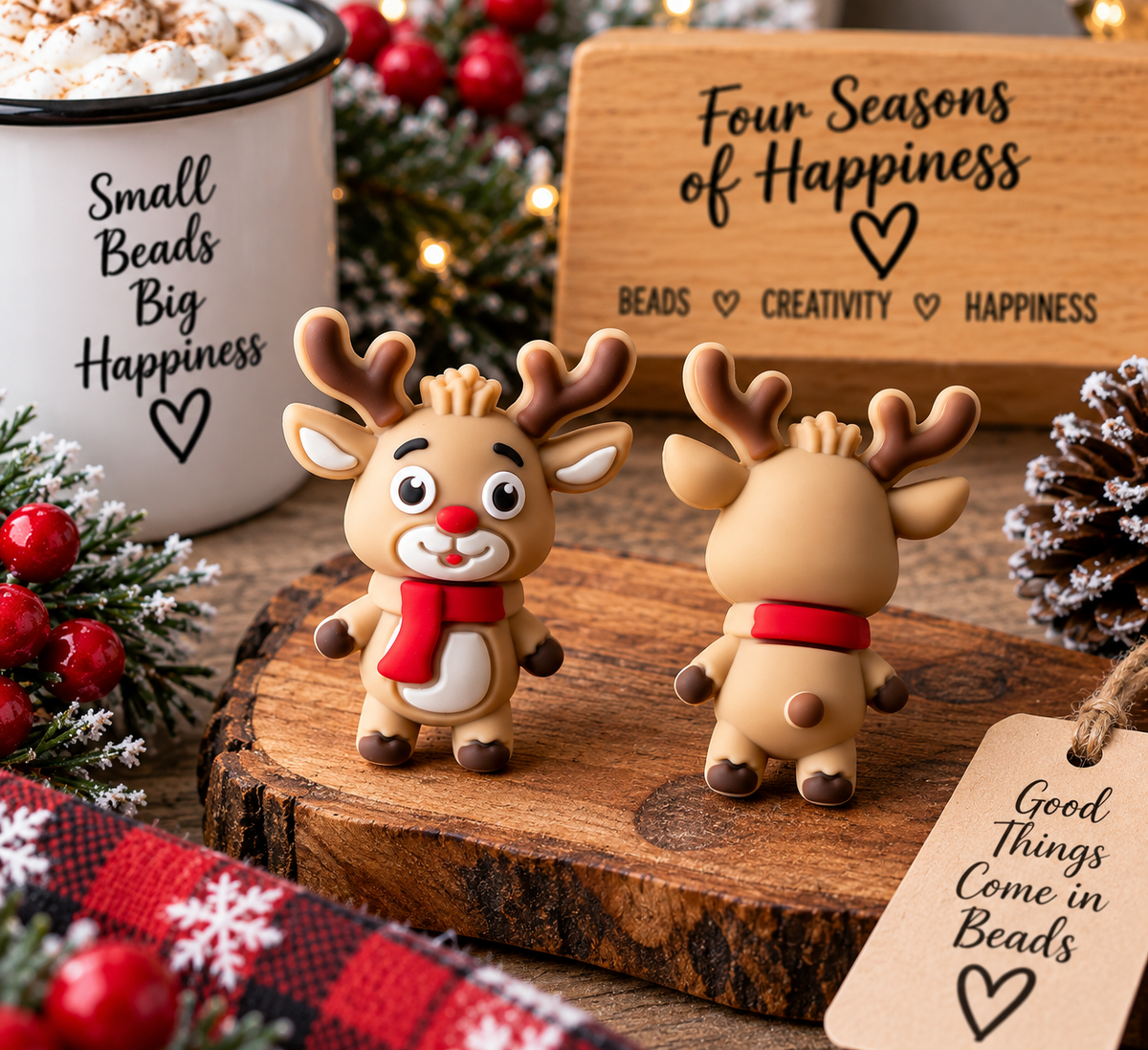 Cute tan Christmas reindeer silicone focal bead with brown antlers, red nose and bright red scarf, shown from the front and back in a cozy holiday setting.
