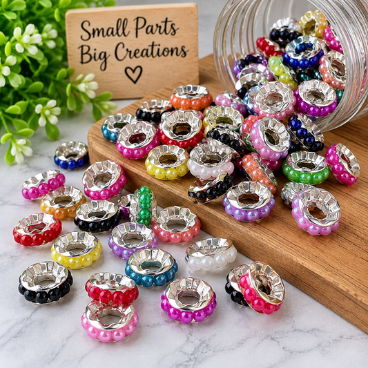 Colorful rhinestone spacer beads with silver centers displayed in a white heart-shaped dish with Four Seasons of Happiness branding.