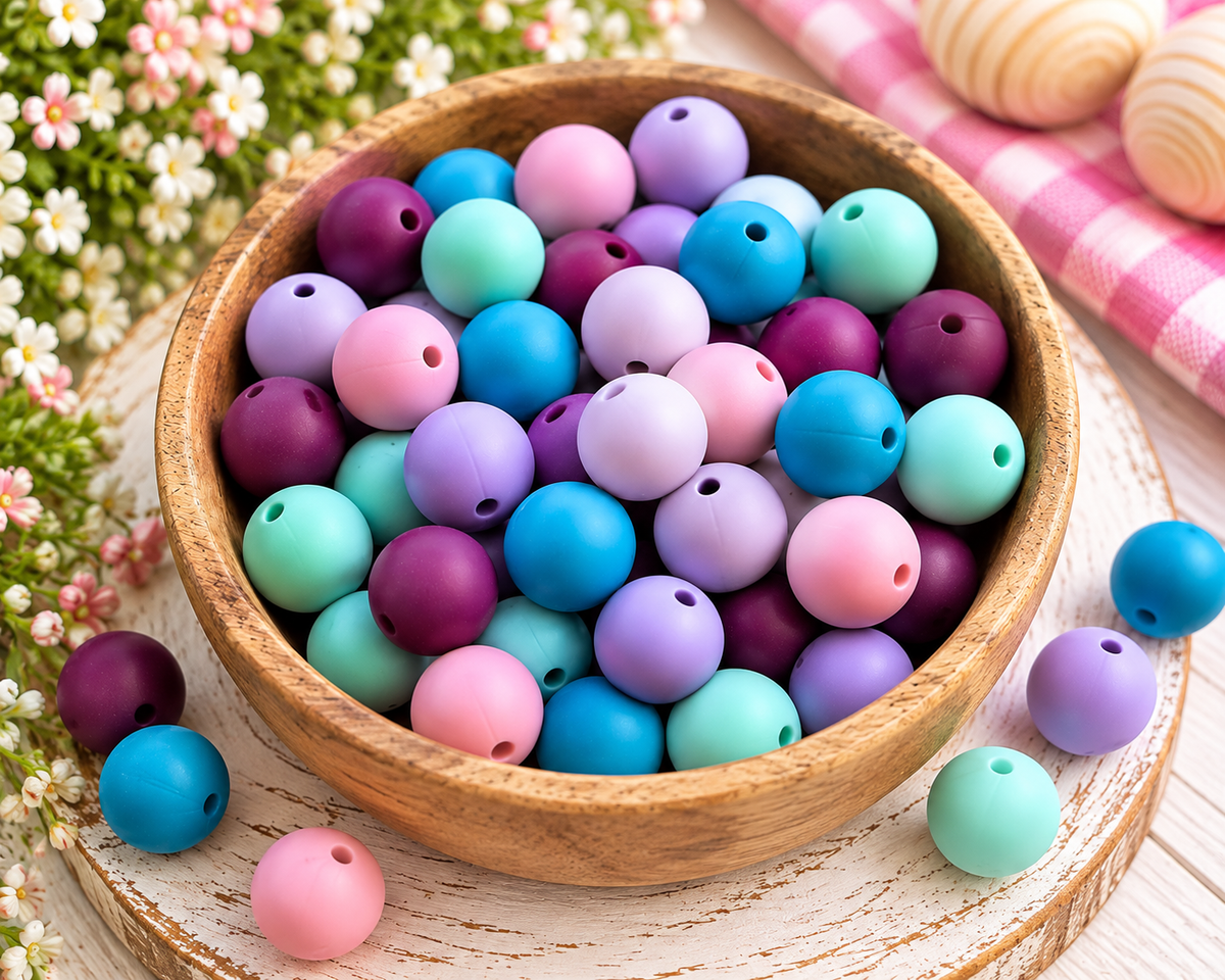 Daydreams & Happy Things 60-count 15mm matte silicone bead mix with purple, lavender, pink, blue and mint beads.