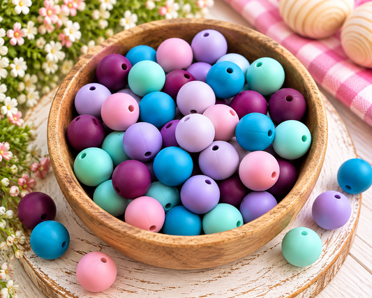 Daydreams & Happy Things 60-count 15mm matte silicone bead mix with purple, lavender, pink, blue and mint beads.