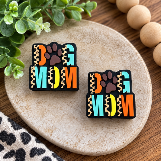 Colorful Dog Mom silicone focal bead with paw print, leopard accents, aqua, orange and yellow details for DIY wristlets, keychains and bead crafts.