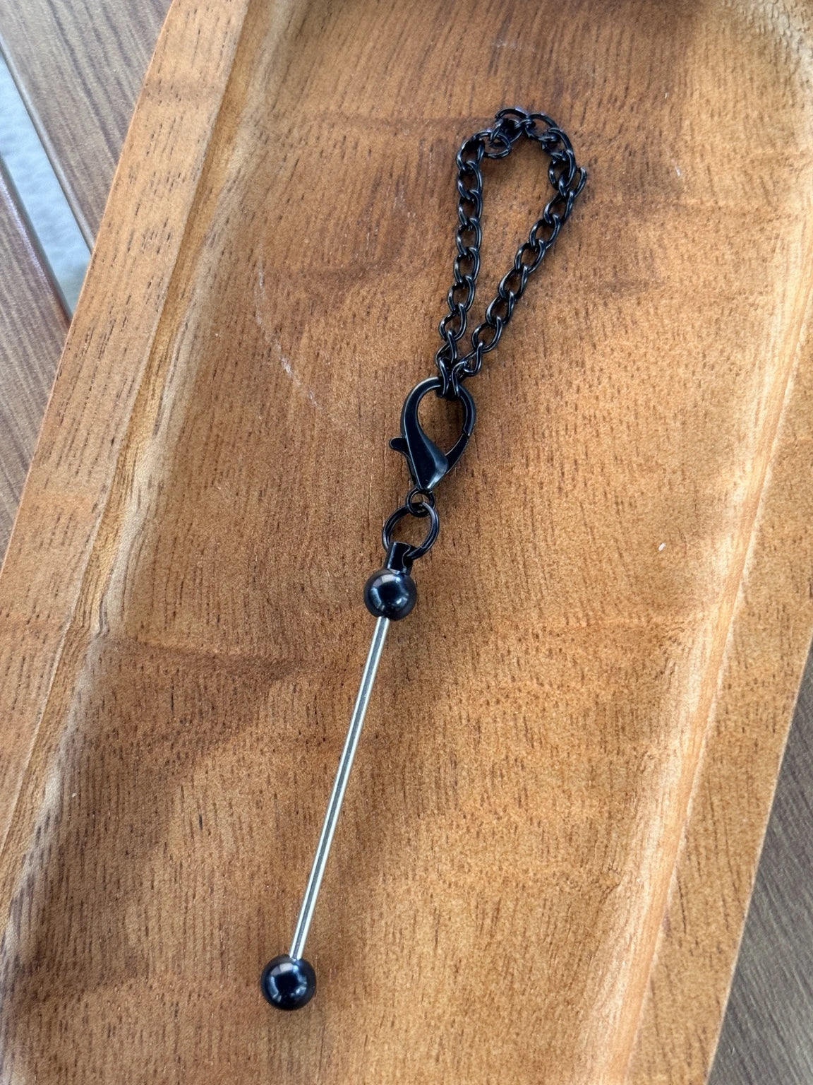     Black chain beadable straw charm hardware featuring a coordinating lobster clasp, decorative chain, and beadable bar, sold in 5-count bags for creating personalized tumbler and drinkware accessories.