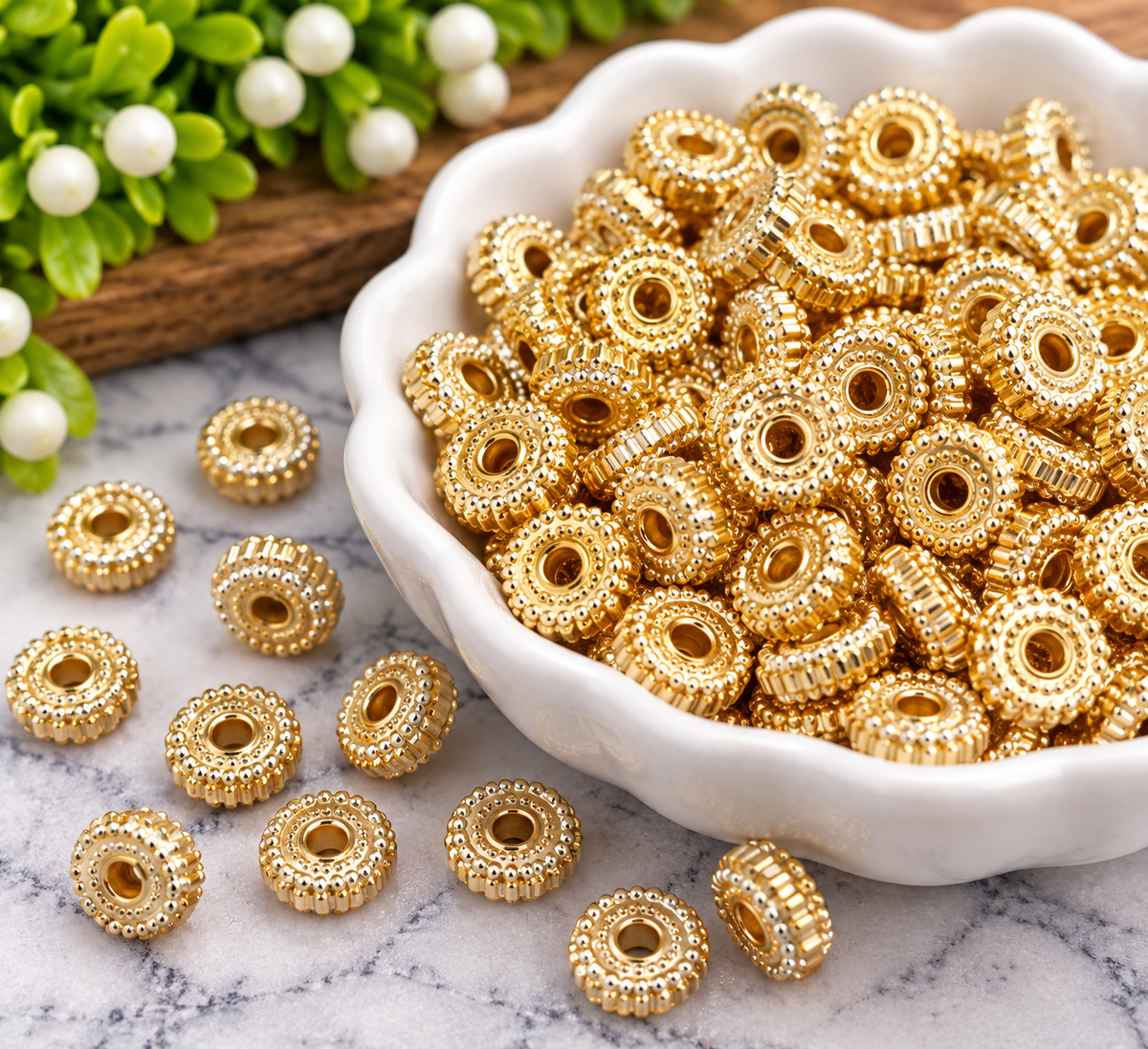 Gilded Glow 8mm gold-tone textured spacer beads with decorative detailing and wide center holes, sold in 50-count bags by Four Seasons of Happiness.