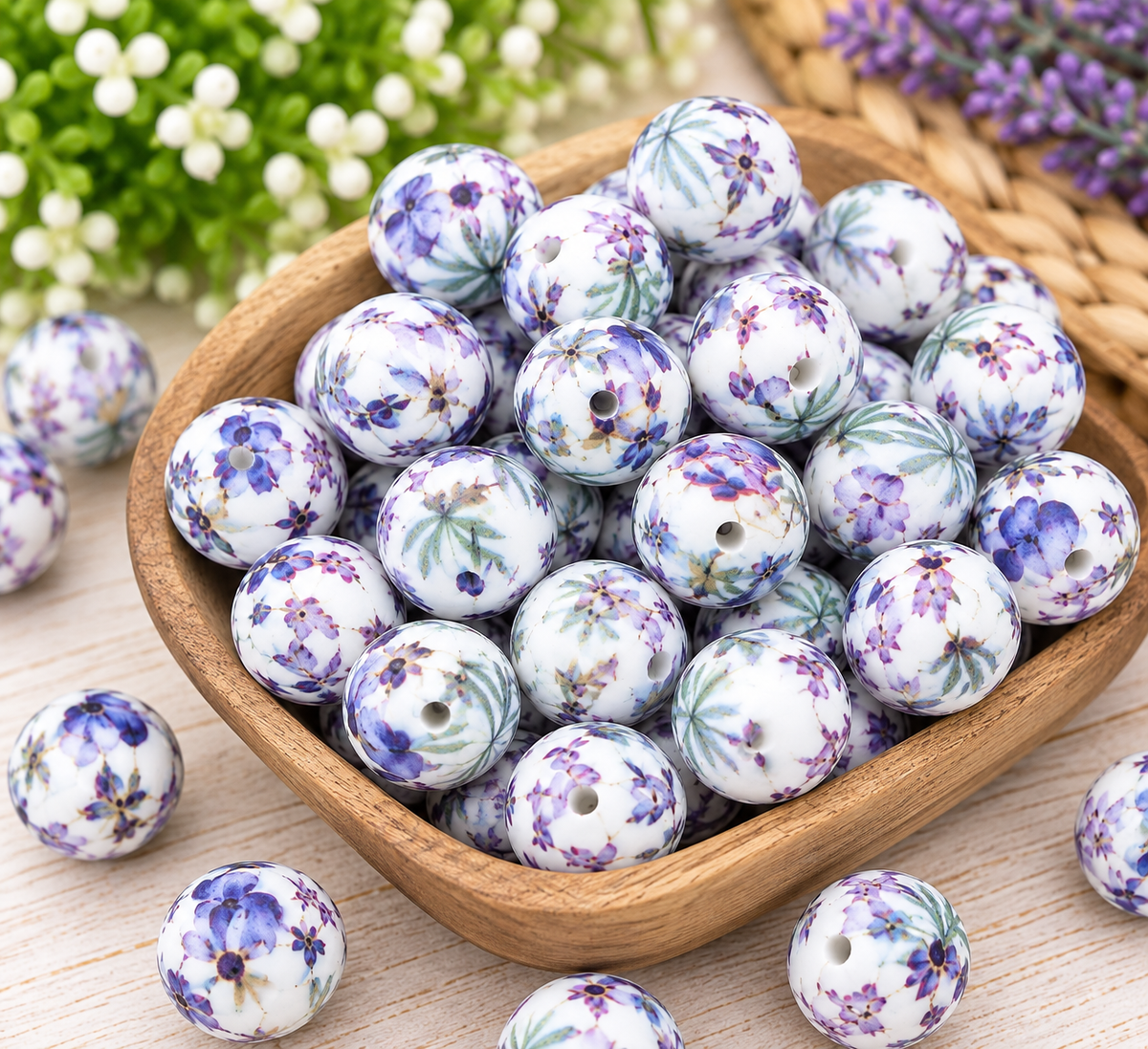 White 15mm printed silicone beads with lavender flowers and green foliage arranged for handmade keychains, bag charms, and creative beading projects.