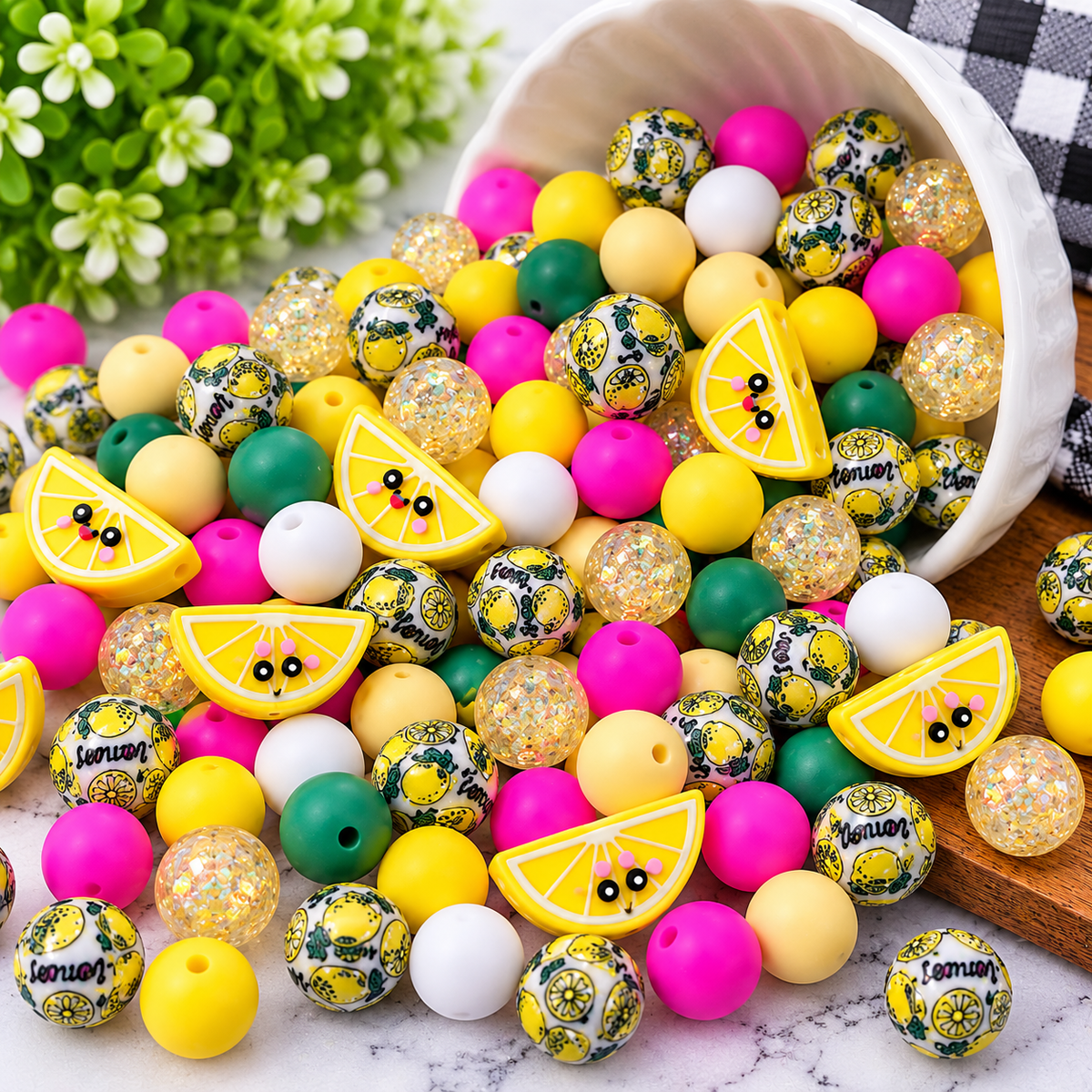 Lemondrop Lexie mixed bead assortment featuring yellow, pink, green and white silicone beads, lemon acrylic beads, glitter beads and lemon focal beads.