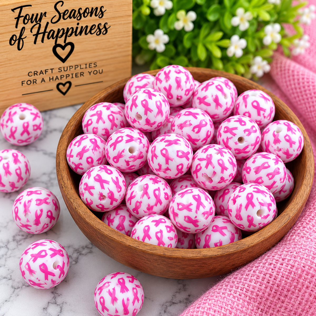 Ribbons of Hope 15mm white silicone round bead with repeating pink awareness ribbon print, sold individually by Four Seasons of Happiness.