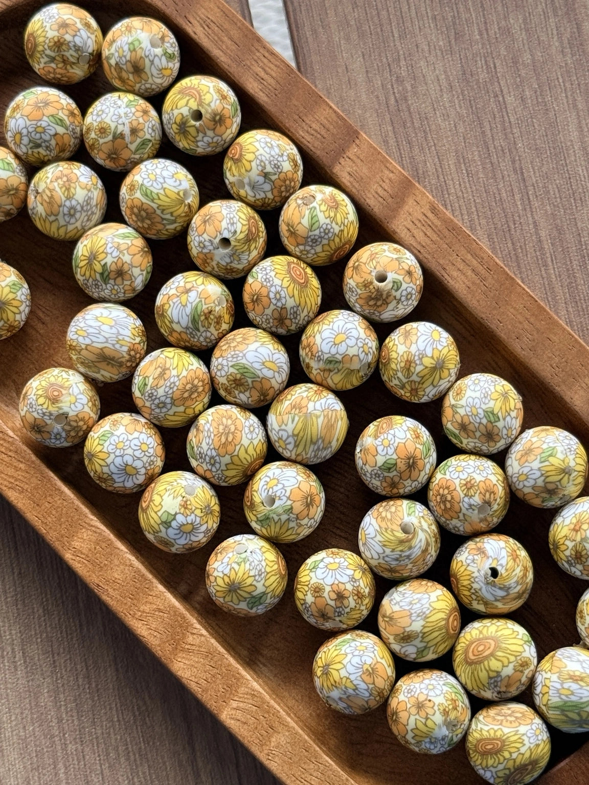 Sunlit Wildflower 15mm printed silicone bead featuring sunflowers, daisies, and vintage floral patterns on a light background.