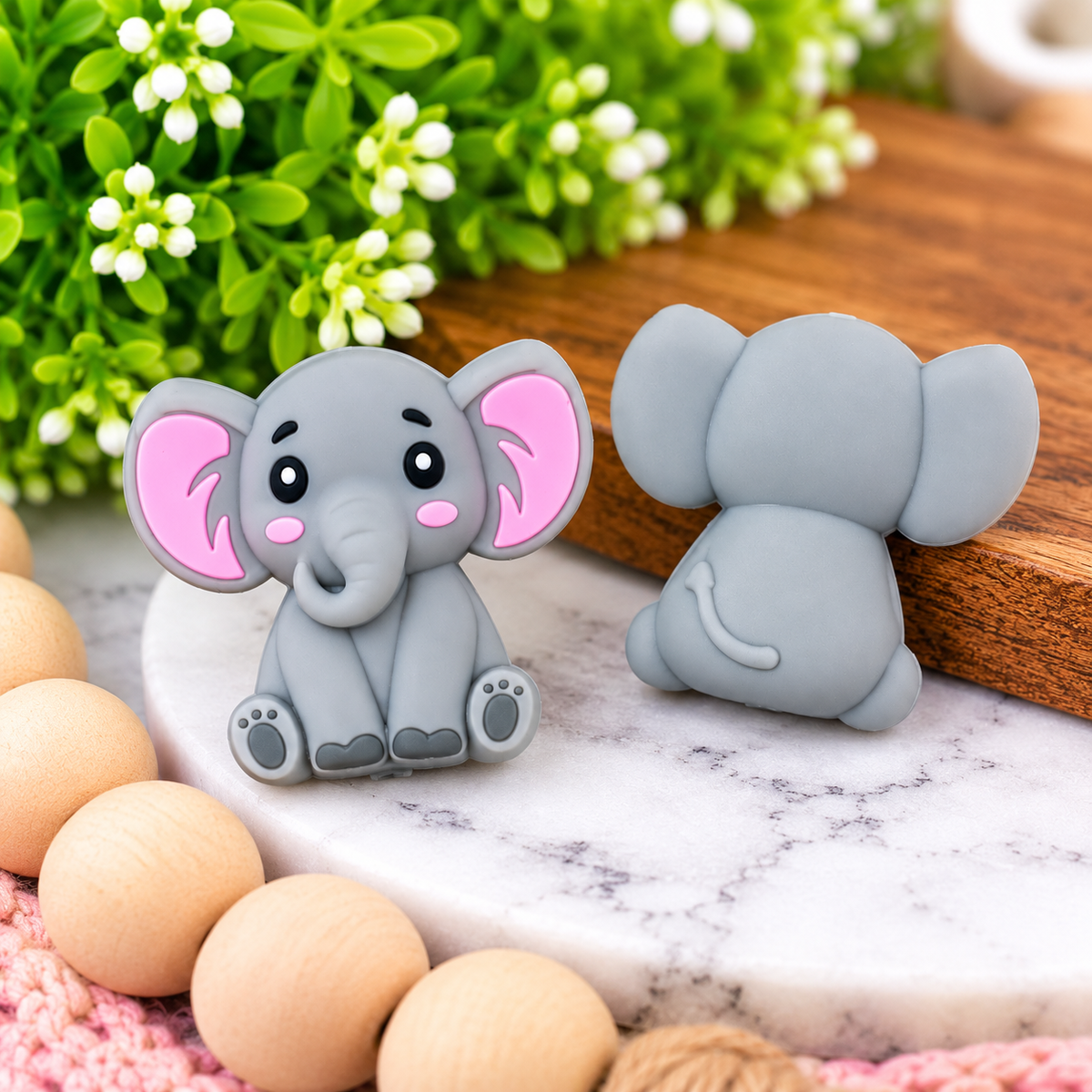 Gray and pink 3D silicone elephant focal bead with oversized ears, curled trunk, rosy cheeks and detailed front and back design.