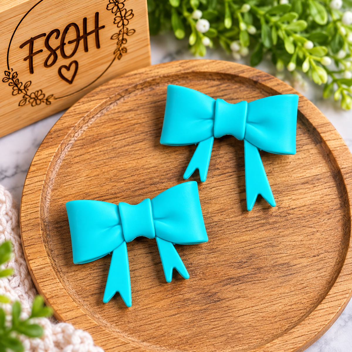 Tropical Lagoon large solid silicone bow focal bead in a vibrant turquoise teal color with dimensional ribbon tails, sold individually for DIY crafts.