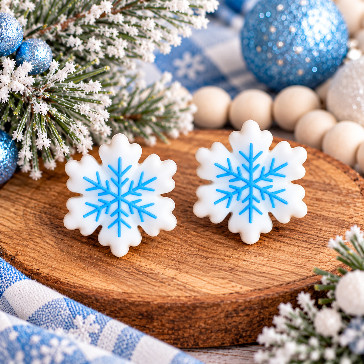 White snowflake silicone focal beads with light-blue snowflake detailing, perfect for DIY winter wristlets, Christmas keychains, and holiday crafting.