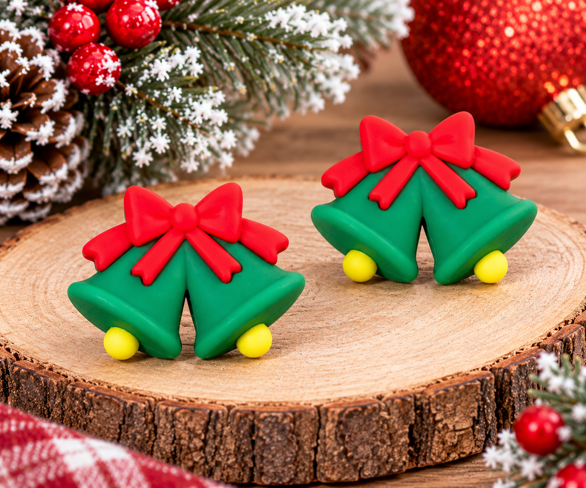 Green Christmas bells silicone focal bead with bright red bow and yellow bell clappers for holiday wristlets, keychains and DIY crafts.