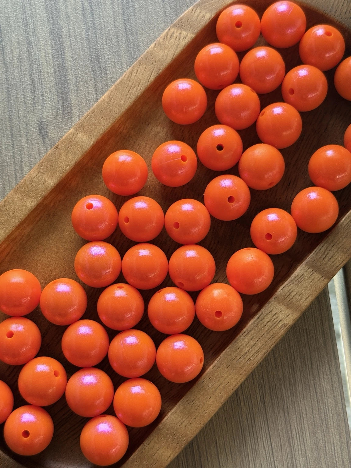Citrus Glow 15mm opal silicone beads in a vibrant orange shade with pearlescent shimmer, ideal for wristlets, keychains, lanyards and DIY bead crafts.