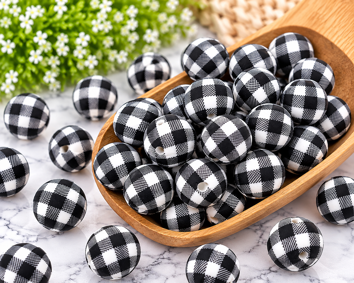 Classic Buffalo Check 15mm printed silicone beads featuring a black and white plaid pattern for DIY wristlets and keychains.