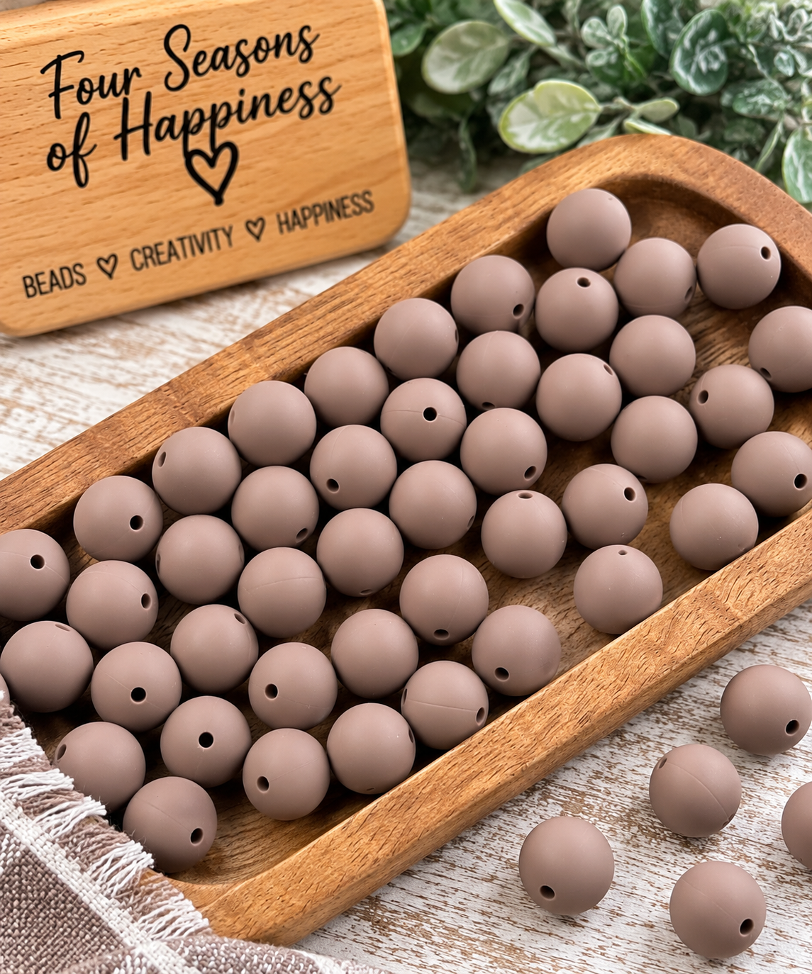 Cocoa Whisper 15mm round silicone beads in a soft matte taupe-brown neutral color for wristlets, keychains, bag charms and DIY crafts.