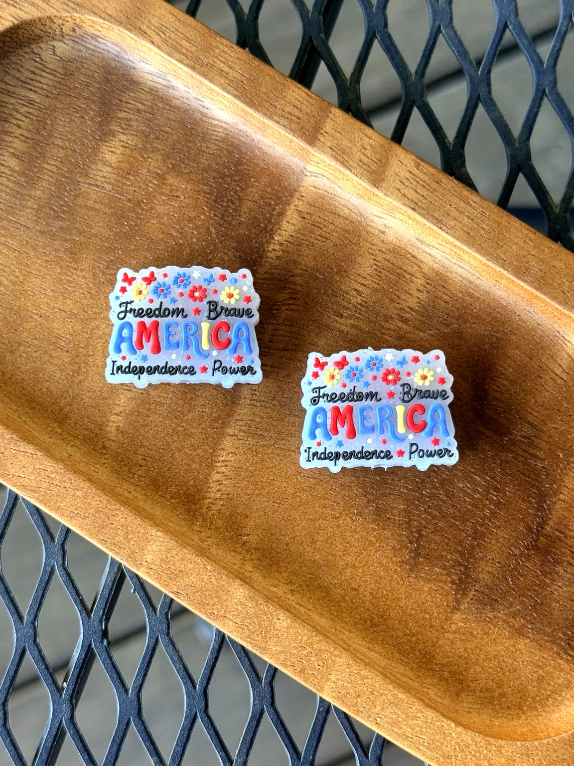 Patriotic America themed silicone focal bead with colorful floral accents and inspirational freedom wording for beadable crafts and accessories