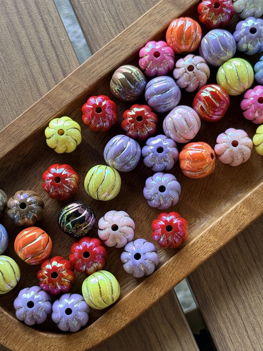 16mm acrylic bead mix featuring pumpkin-shaped and round beads in fall harvest colors including orange, lavender, red, blush pink, green, and marbled autumn tones for seasonal crafting projects.