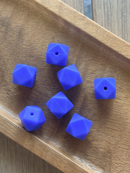 Blueberry Bliss 14mm silicone hexagon beads displayed in a wooden tray for beadable pens, keychains, wristlets, badge reels, and DIY craft projects.