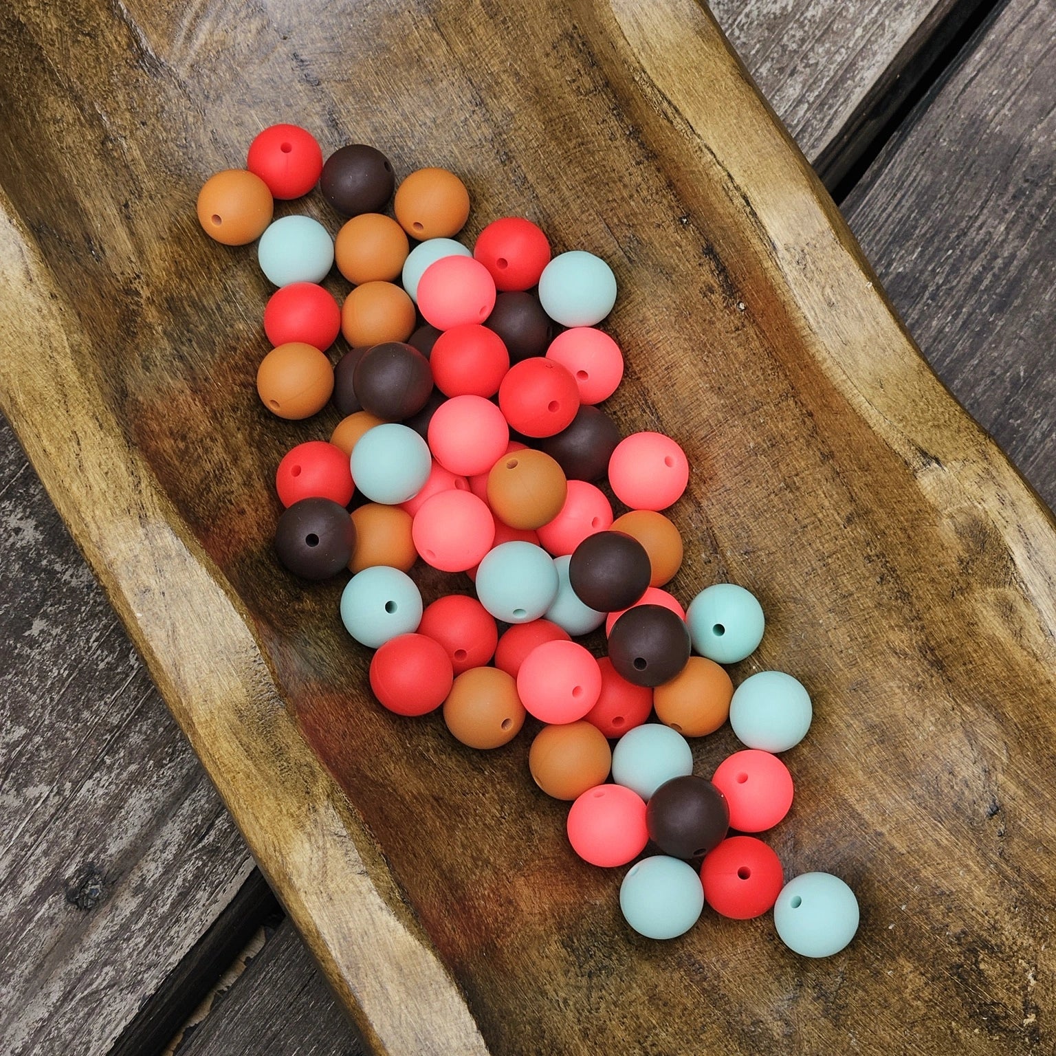 Boots and Blooms™ 15mm silicone bead mix from Four Seasons of Happiness featuring Coastal Mint, Mocha Bean, Terracotta Trail, Watermelon Splash, and Cherry Pop. Includes 60 BPA-free silicone beads for beadable pens, wristlets, keychains, badge reels, jewelry, and DIY crafts.