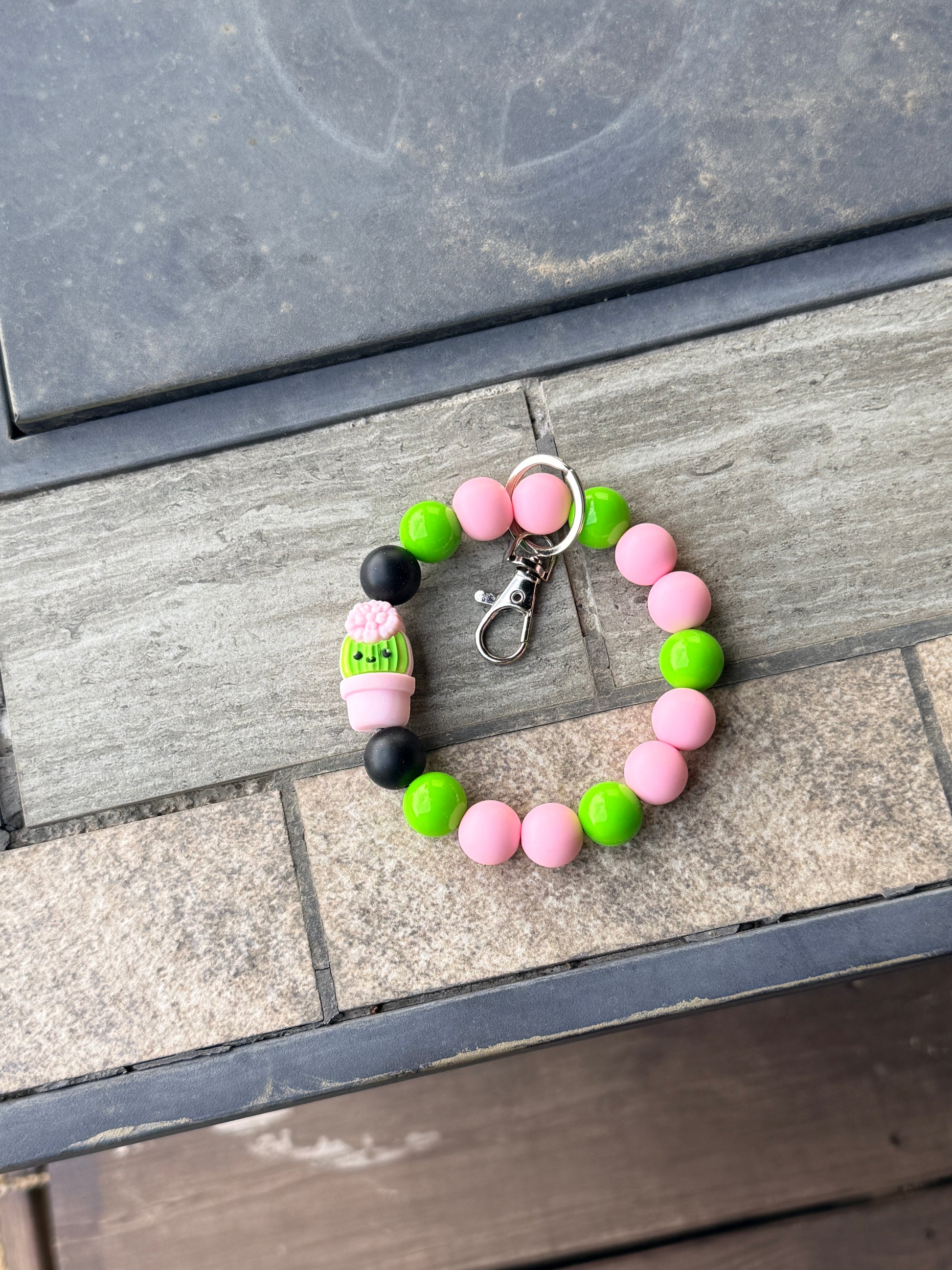 FSOH silicone wristlet keychain with pink and green beads and cute cactus charm on white background