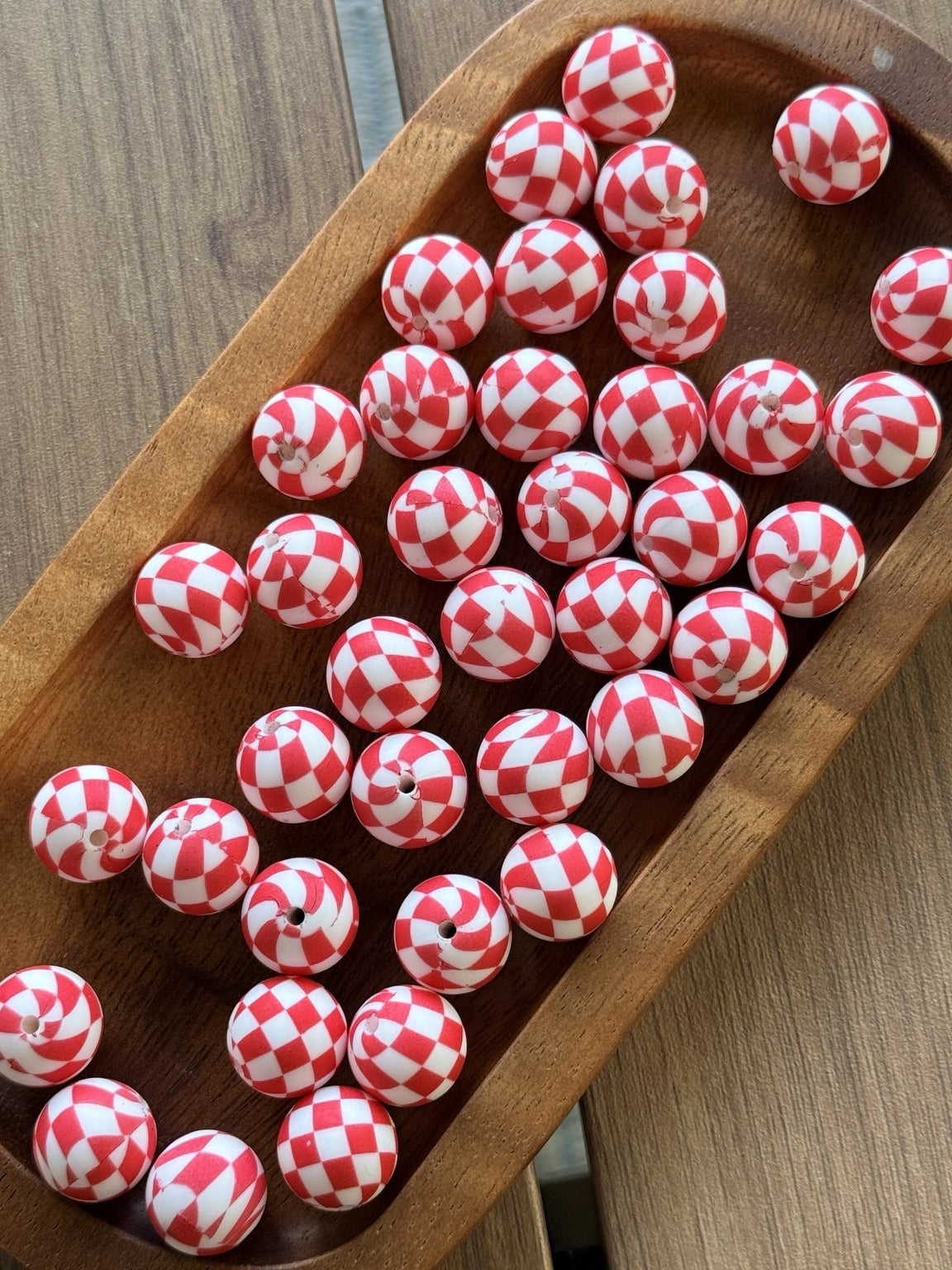     Red and white Candy Cane Lane 15mm printed silicone bead featuring festive candy swirl and checkerboard patterns for beadable pens, keychains, wristlets, badge reels, and DIY crafts