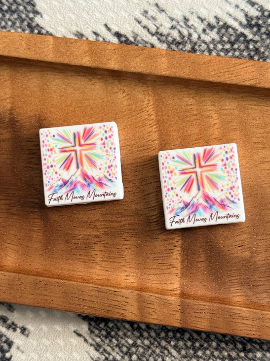 Colorful Faith Moves Mountains silicone focal bead featuring a cross above watercolor mountains for Christian pens, keychains, wristlets and DIY crafts.
