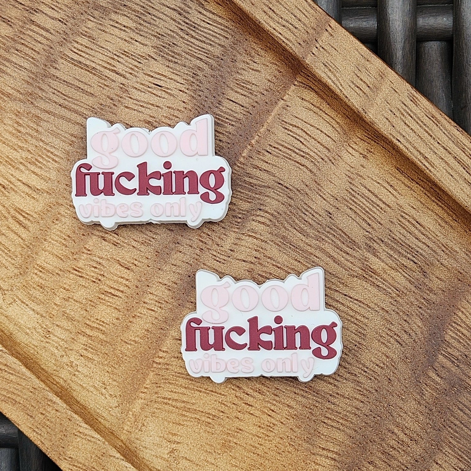 Layered silicone focal bead featuring the phrase “Good Fucking Vibes Only” in pink and burgundy lettering. Perfect for beadable pens, keychains, wristlets, badge reels, bookmarks, zipper pulls, lanyards, and DIY craft projects from Four Seasons of Happiness.