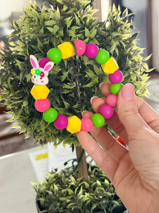 FSOH Easter bunny silicone wristlet keychain with bright pink, green, and yellow beads and glitter accents