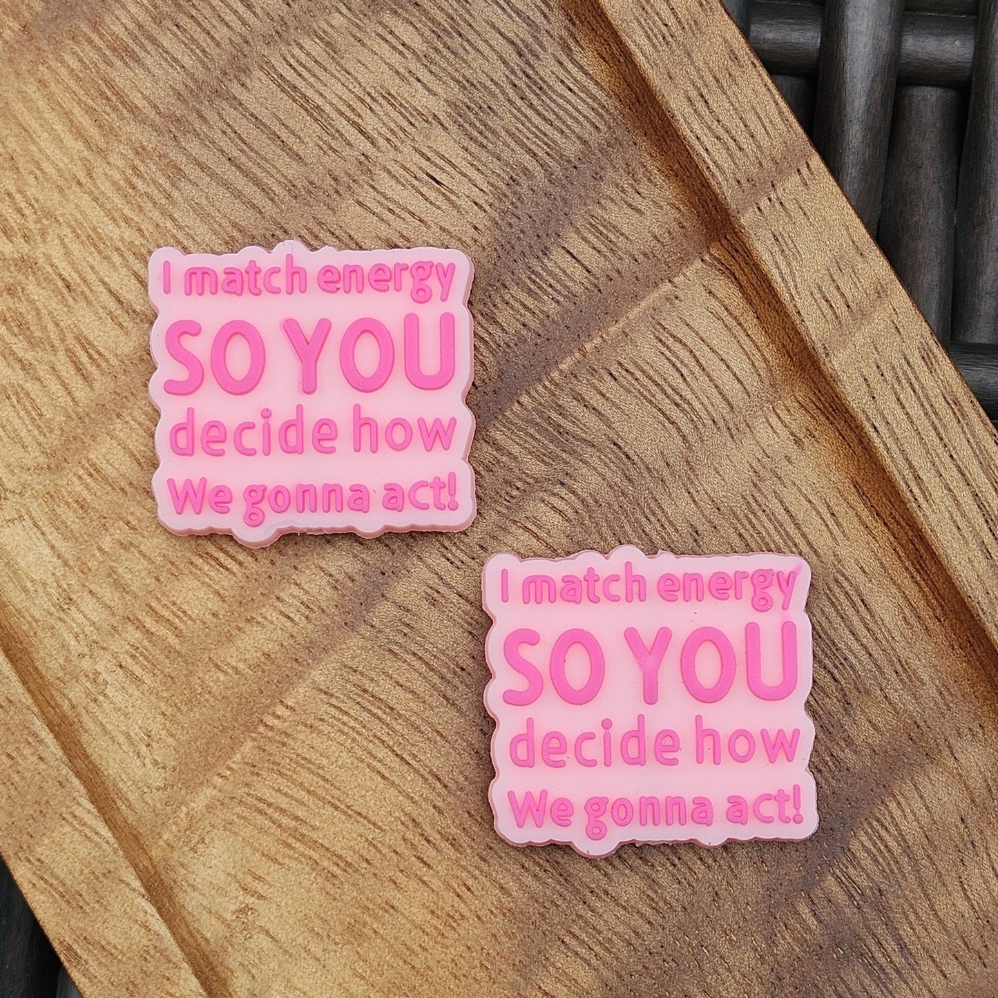Pink silicone focal bead featuring the quote “I Match Energy So You Decide How We Gonna Act.” Perfect for beadable pens, keychains, wristlets, badge reels, bookmarks, zipper pulls, lanyards, and DIY craft projects from Four Seasons of Happiness.