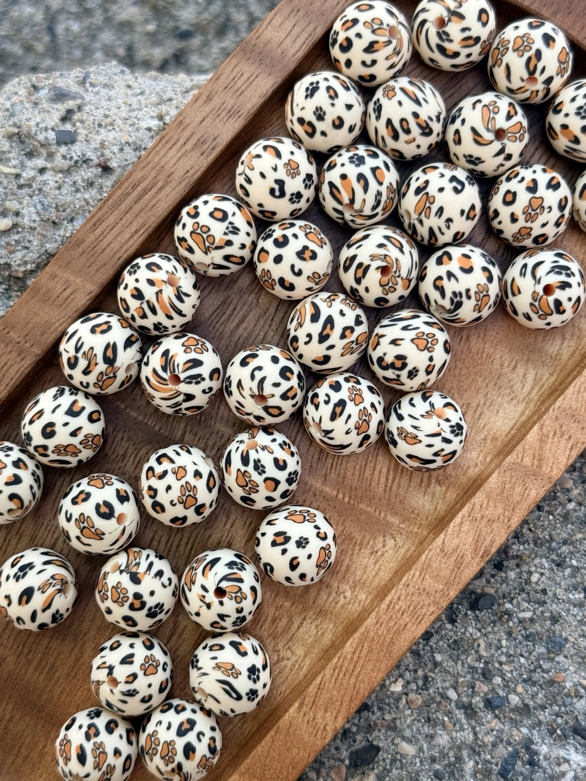 15mm silicone printed bead featuring leopard print and paw print designs for DIY keychains, wristlets, beadable pens, and pet-themed handmade crafts.