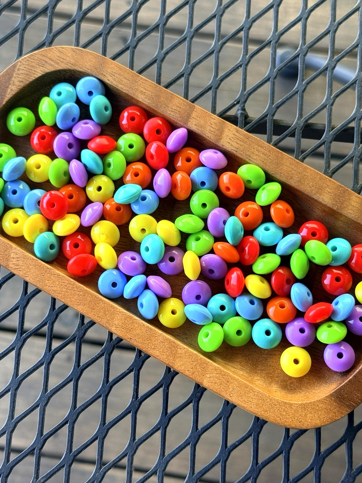 Bright mixed color liquid silicone lentil beads in red, yellow, blue, green, orange, and purple for beadable pens, wristlets, and DIY crafts