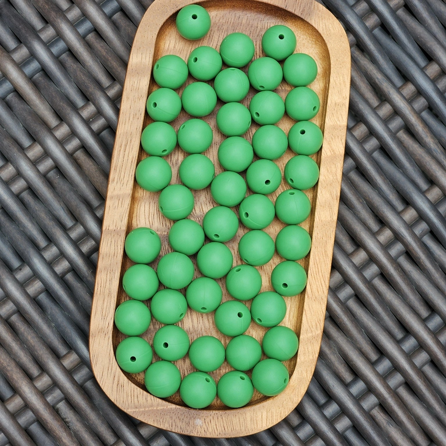 FSOH Lucky Clover 15mm premium matte green silicone round beads displayed on a wooden tray for keychains, wristlets, badge reels, beaded pens, baby accessories, and DIY craft projects.
