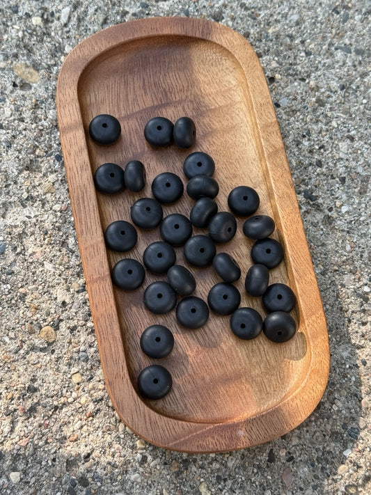 Midnight Onyx 14mm matte black silicone abacus spacer beads from Four Seasons of Happiness. BPA-free craft beads sold in 25-count bags for beadable pens, keychains, wristlets, badge reels, and DIY projects.