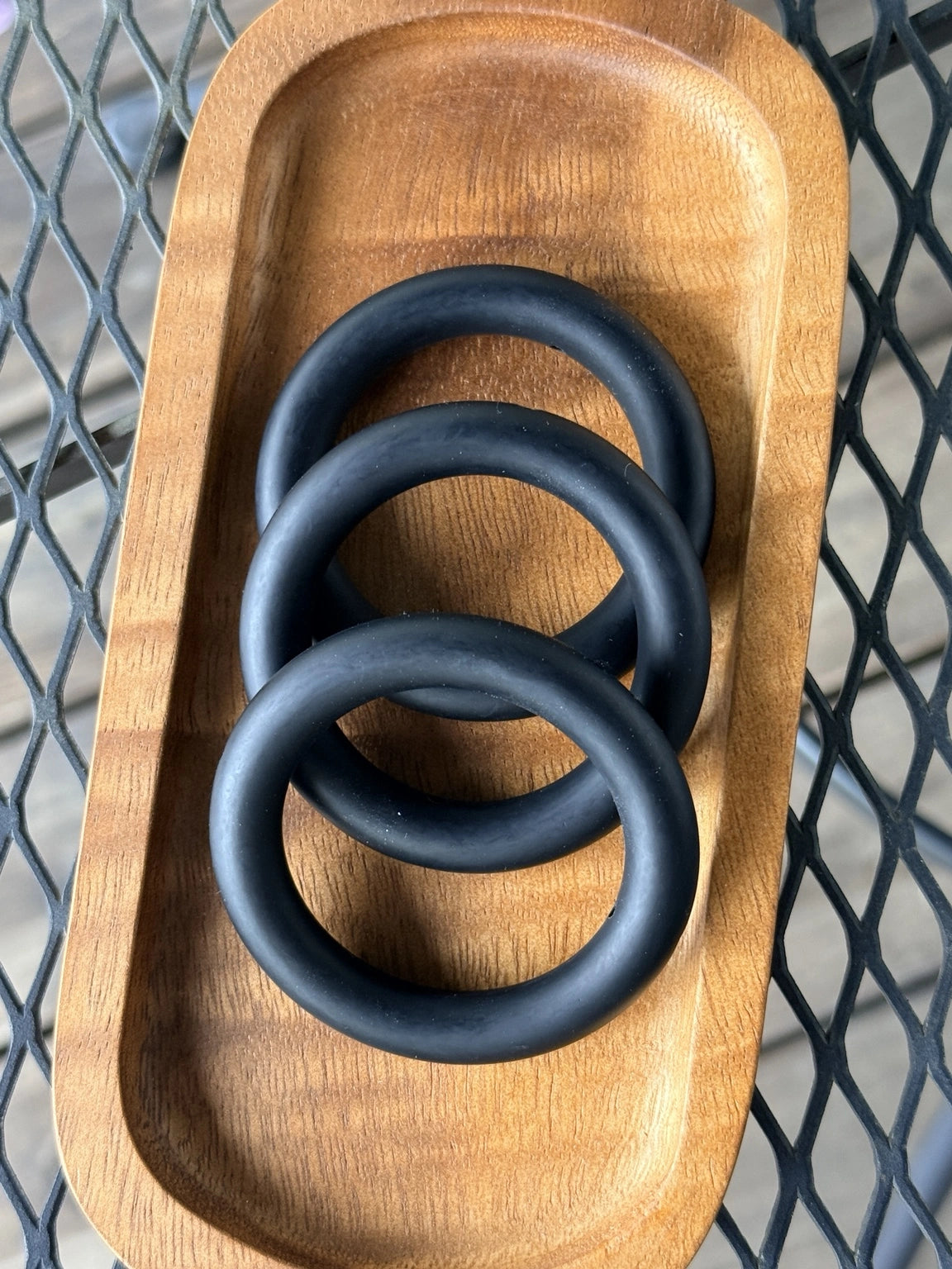 Matte black 65mm silicone ring bead for keychains, wristlets, stroller charms, sensory crafts, teething accessories, and DIY bead projects.