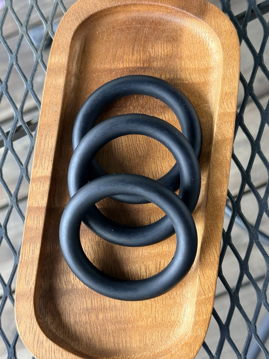 Matte black 65mm silicone ring bead for keychains, wristlets, stroller charms, sensory crafts, teething accessories, and DIY bead projects.