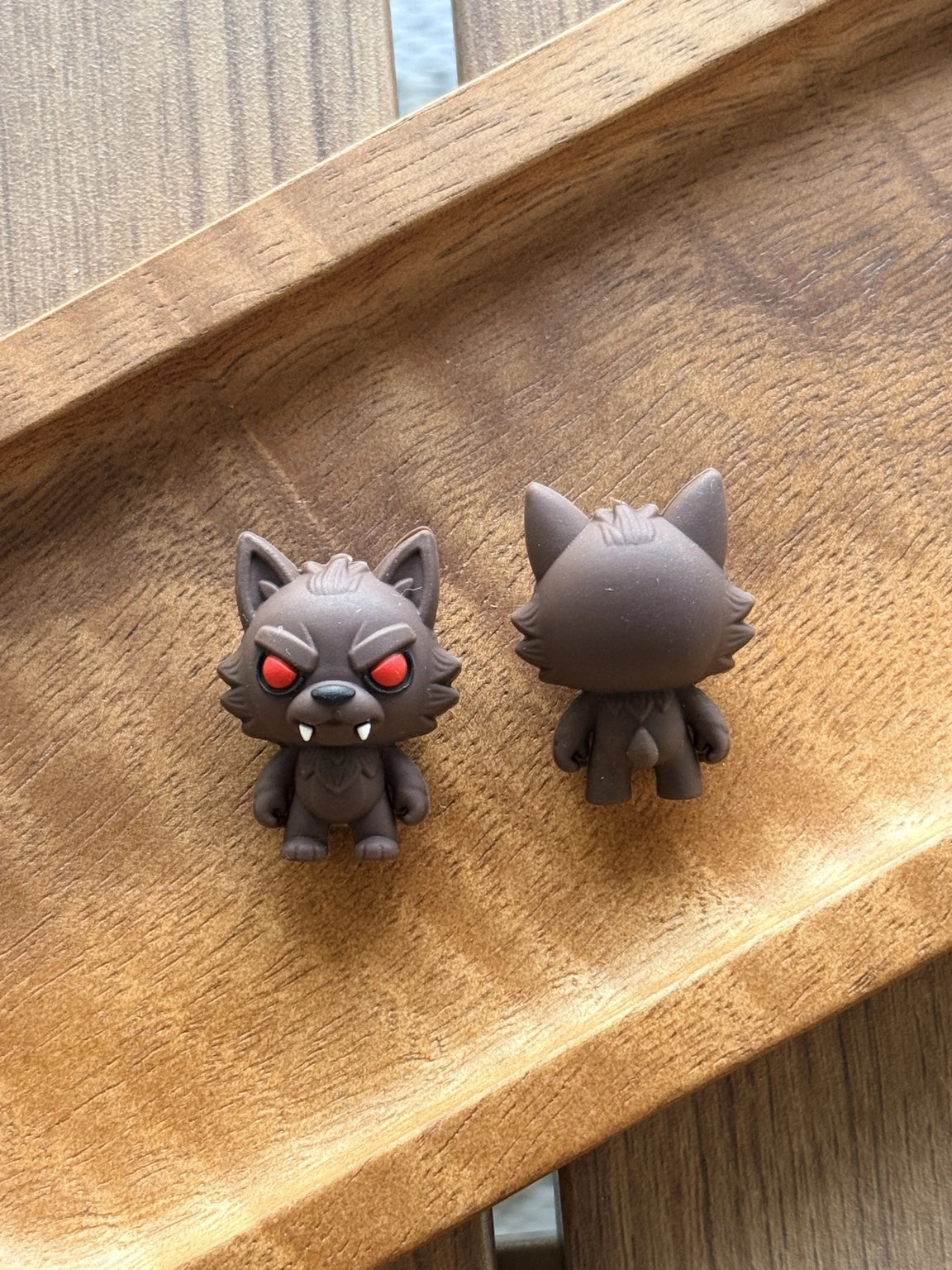 3D silicone werewolf focal bead featuring dark brown fur, red eyes, pointed ears, and fang details for Halloween keychains, wristlets, badge reels, and DIY craft projects.