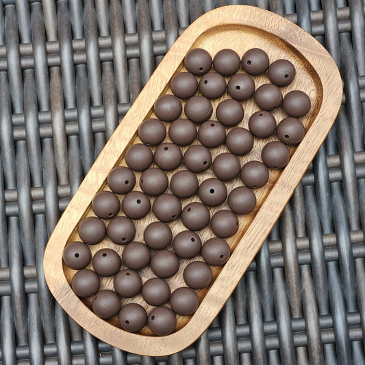 FSOH Mocha Bean premium 15mm silicone round beads in a rich matte chocolate brown. BPA-free food-grade silicone beads available in 1, 15, 30, 60 and 120 count options for beadable pens, wristlets, keychains, badge reels, bookmarks, jewelry, and DIY craft projects.